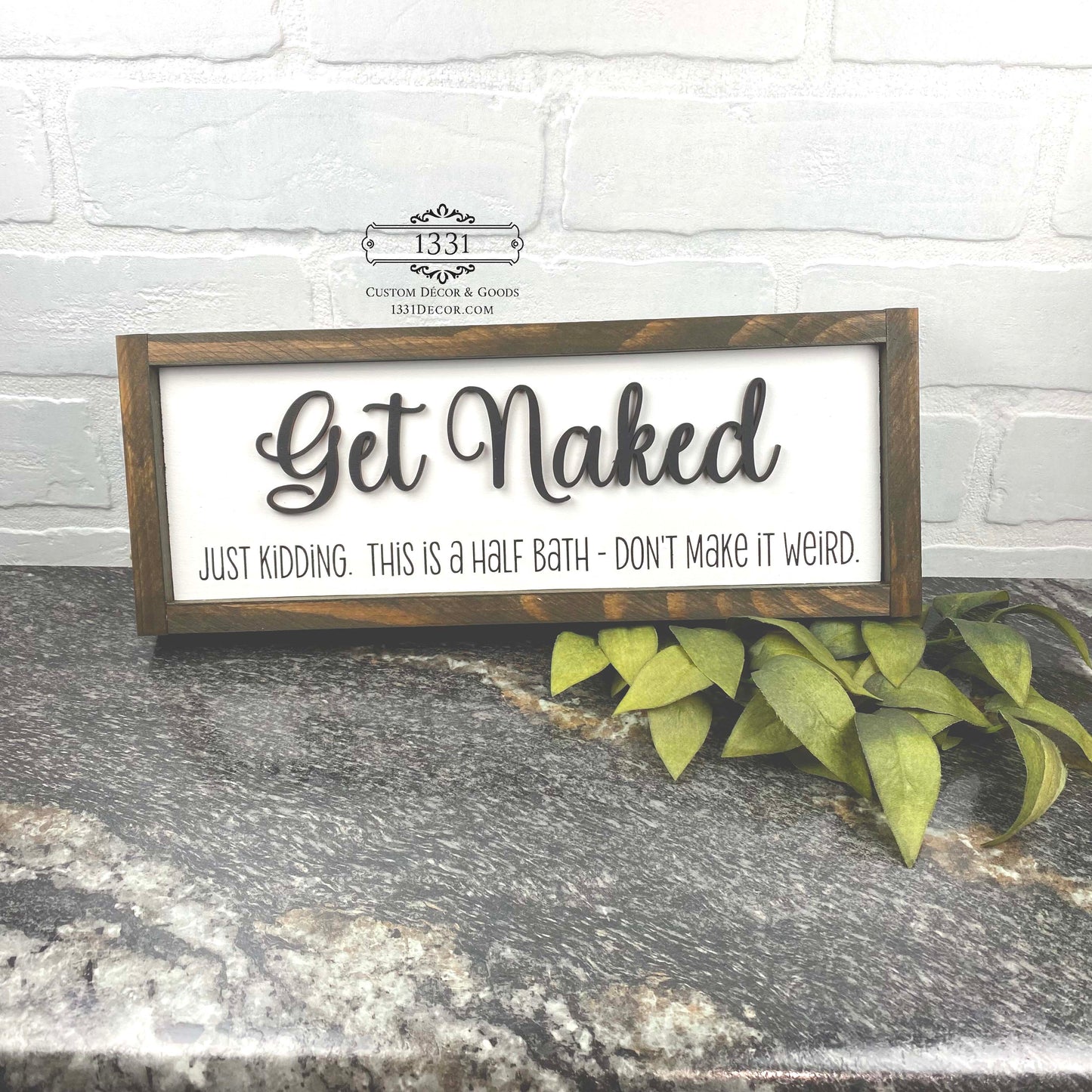 Get Naked, Just Kidding sign